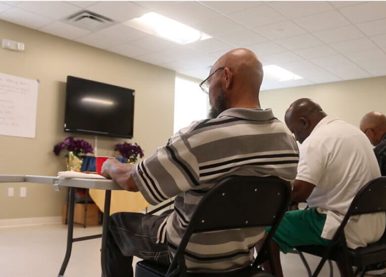 Fathers sitting in a class setting